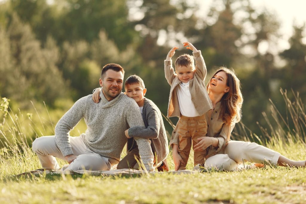 cute-family-playing-in-summer-field-scaled