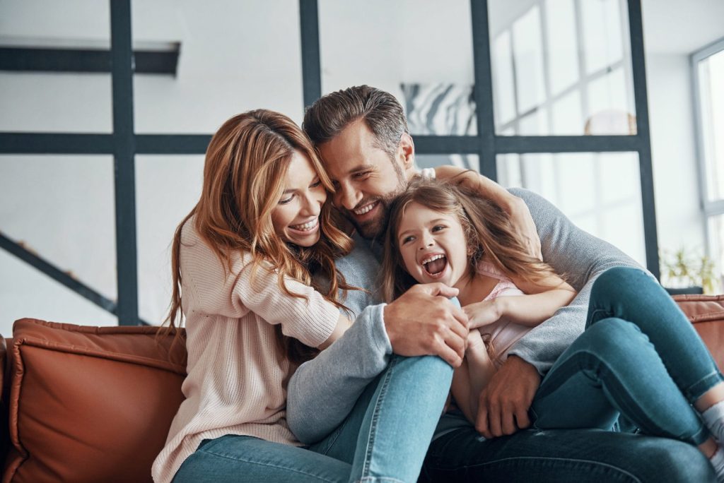 happy-young-family-bonding-together-home-scaled