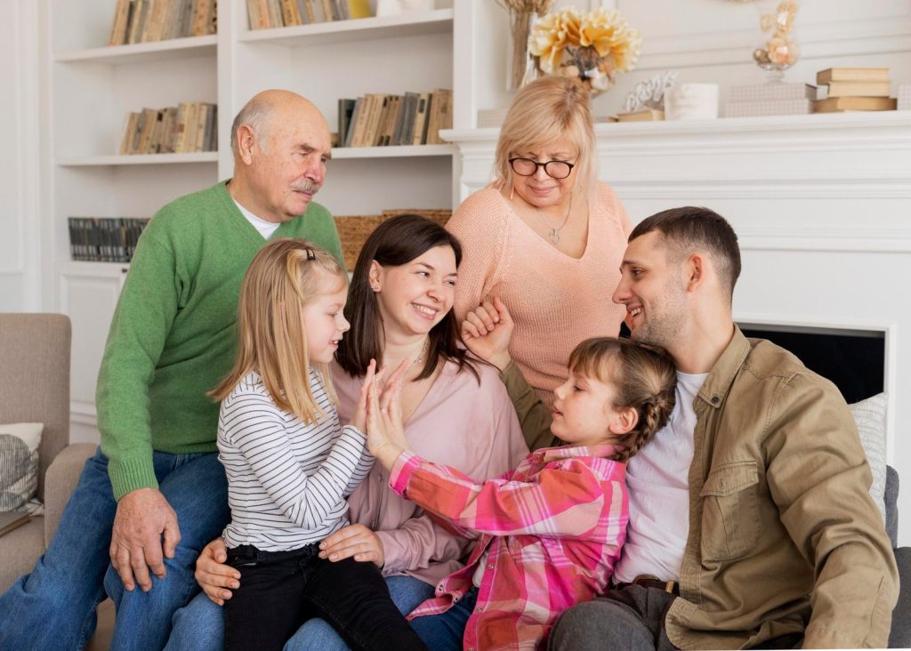 medium-shot-happy-family-couch-scaled