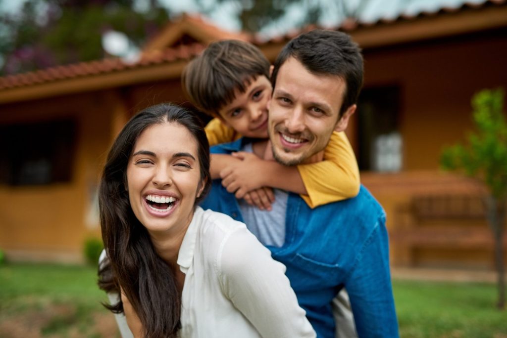 portrait-outdoor-family-with-happiness-funny-bonding-with-joy-laughing-loving-face-parents-mother-with-father-male-child-boy-outside-house-real-estate-with-weekend-break-scaled