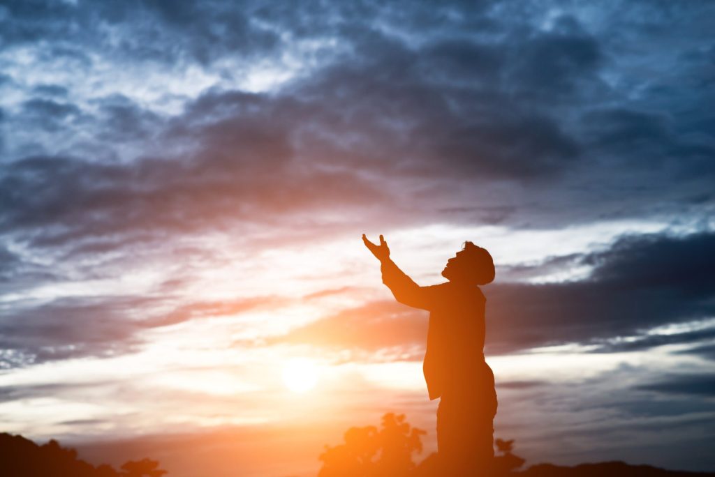 silhouette-of-handsome-asian-man-praying-scaled