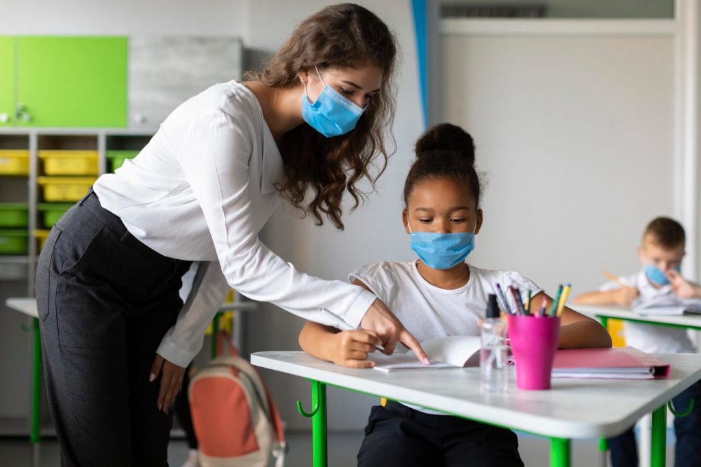 teacher-showing-student-how-to-solve-problem-scaled